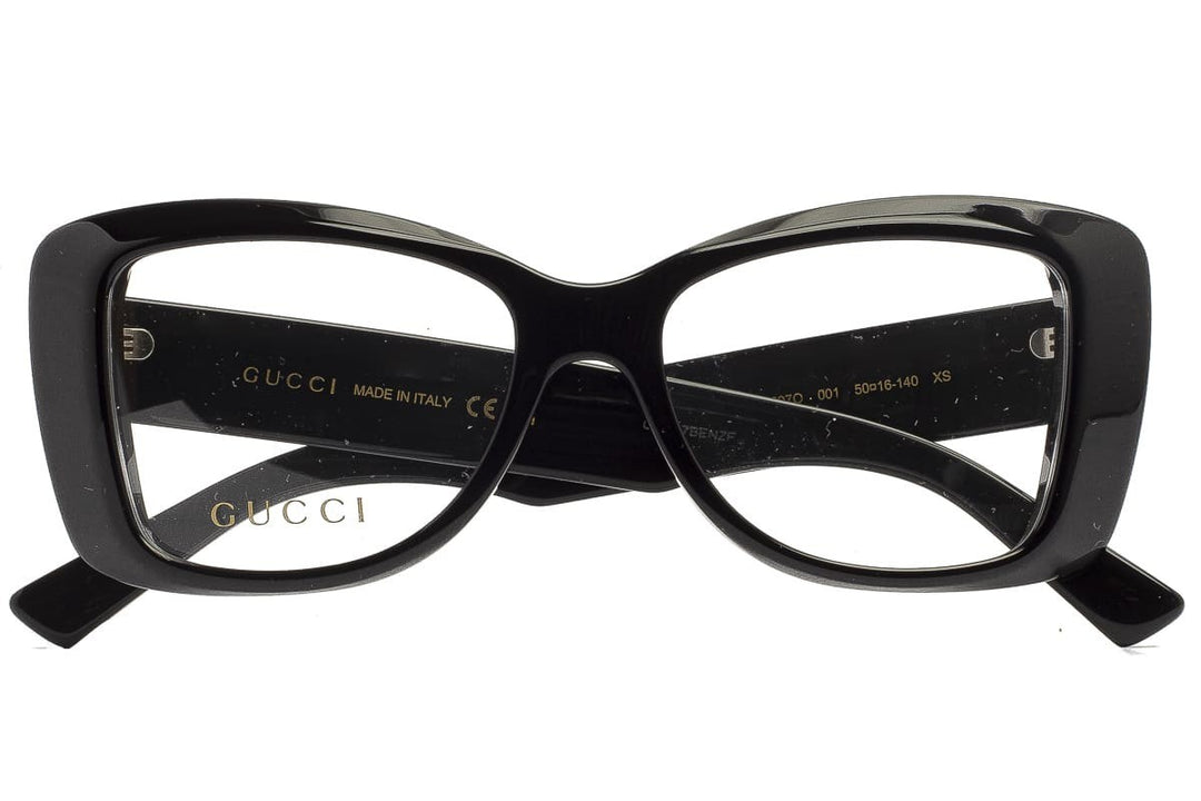 Black cat-eye eyeglass frames with Gucci logo on inner arms