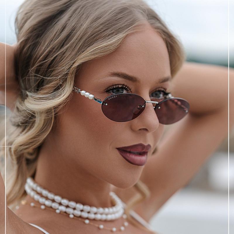 Gucci GG1257S Gafas de sol redondeadas con lentes marrones y rojos