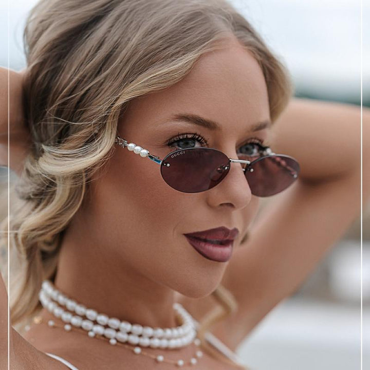 Gucci GG1257S Gafas de sol redondeadas con lentes marrones y rojos