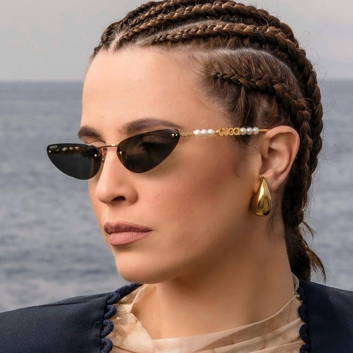 Gucci GG1257S Gafas de sol redondeadas con lentes marrones y rojos