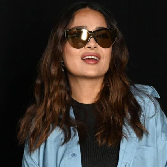 Balenciaga shield sunglasses on model, brown frame with dark lenses