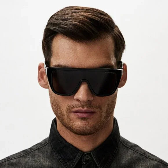 Black oversized sunglasses with dark tinted lenses, skull temple detail