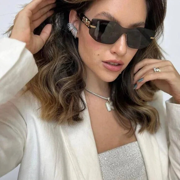 Fendi Fendigraphy black sunglasses worn, gold logo temples and dark lenses