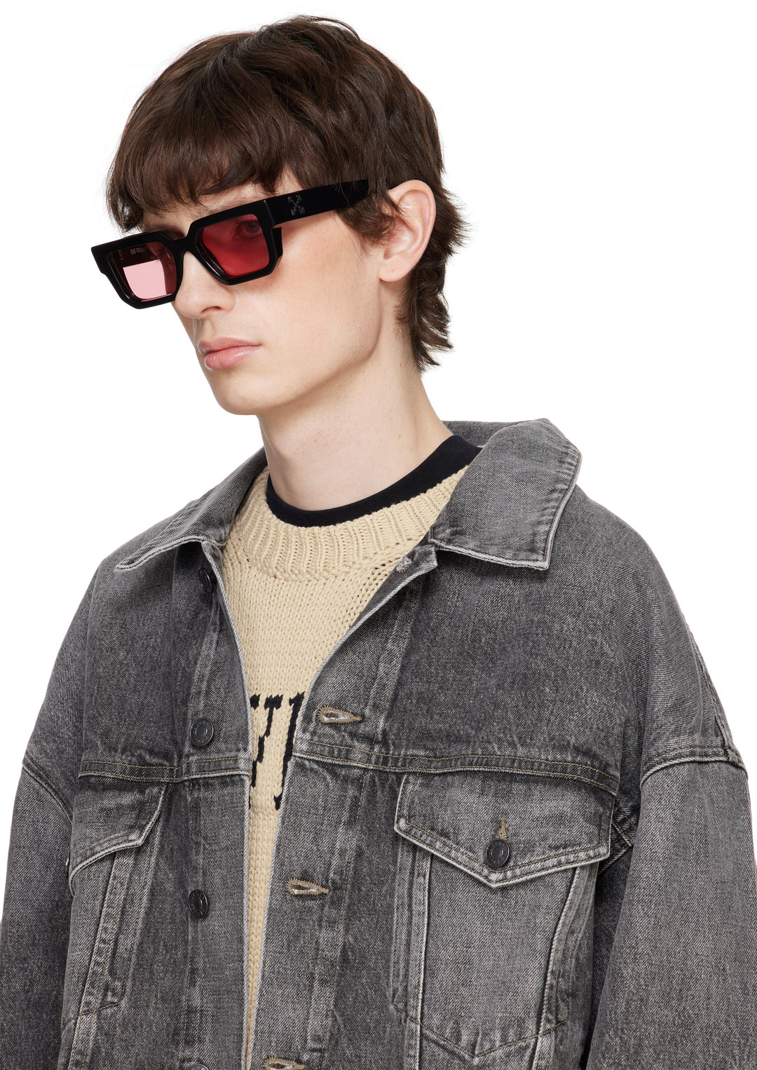 Black square sunglasses on model, side profile, with pink tinted lenses