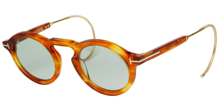 Brown round sunglasses with gold-tone metal temples and amber tortoise frames