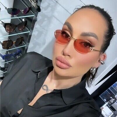 Gold thin-frame round sunglasses with red tinted lenses