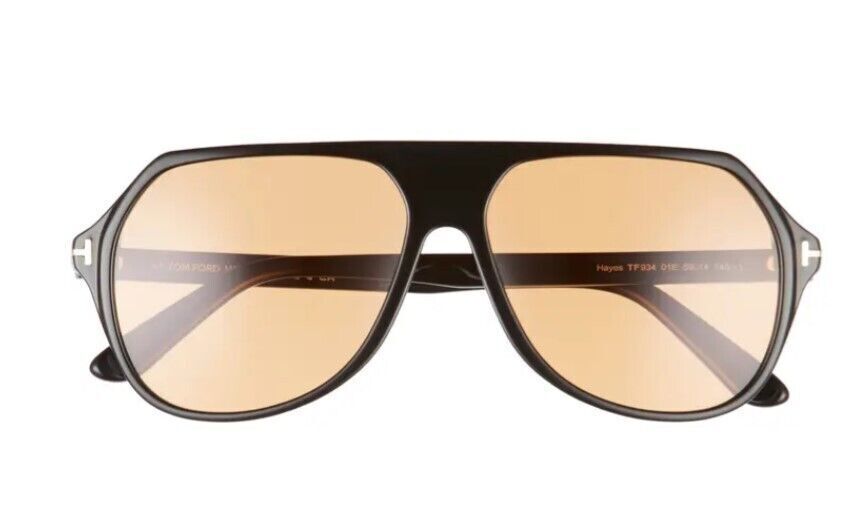 Black aviator sunglasses with amber lenses, Tom Ford logo on temple