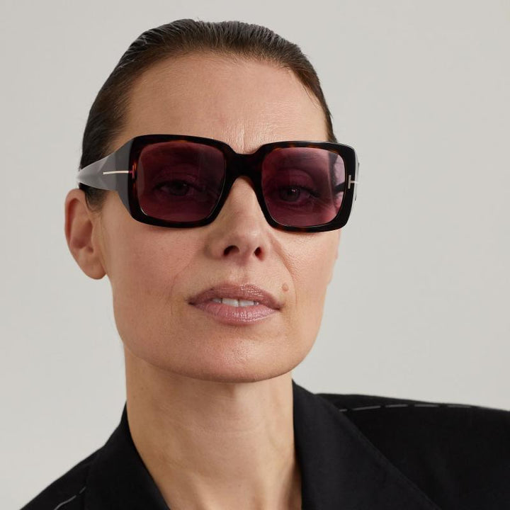 Brown-violet square sunglasses with tinted lenses worn on a model
