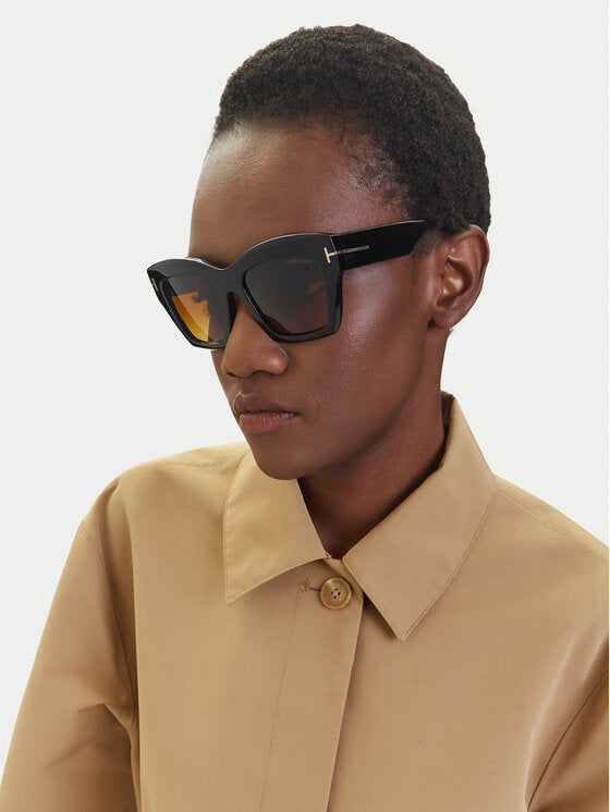Square sunglasses on model, dark tortoiseshell frame with amber lenses and T logo