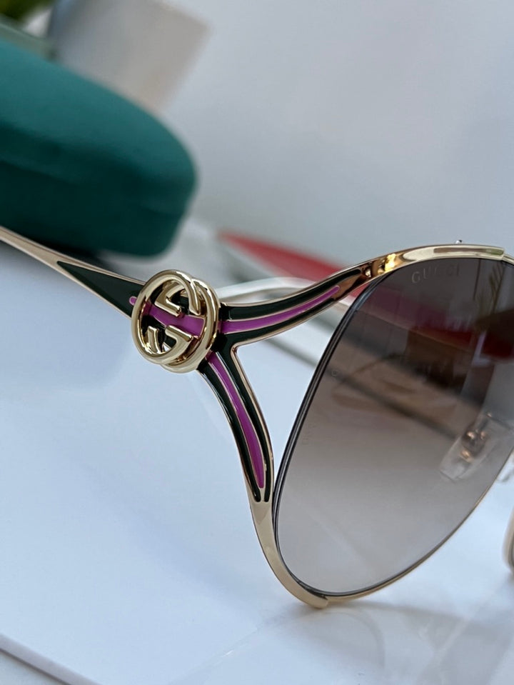 Gafas de sol de metal con recorte extragrandes en oro rosa Gucci GG0225S