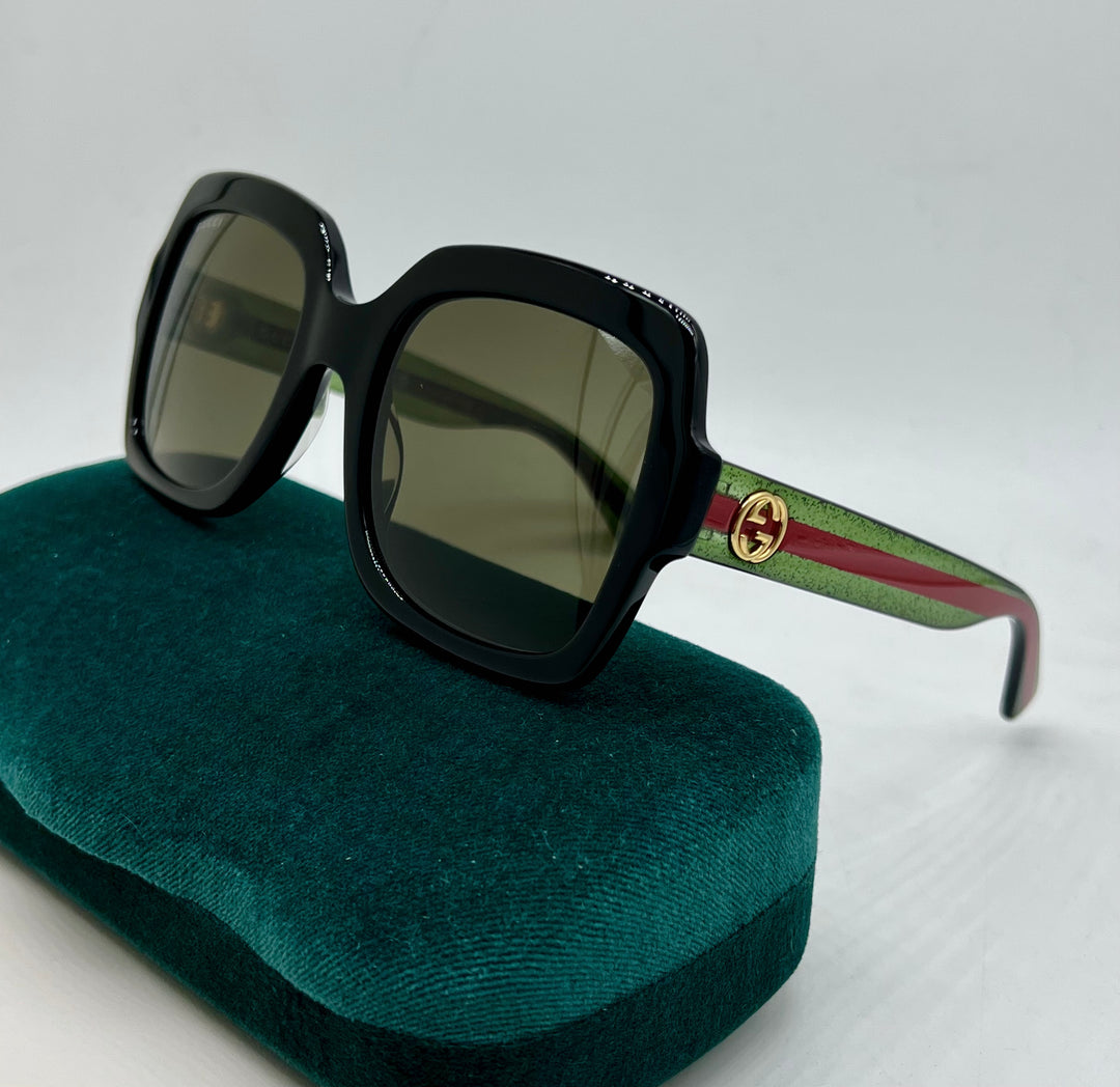 Gucci GG0036SN Gafas de sol cuadradas con patas a rayas y purpurina