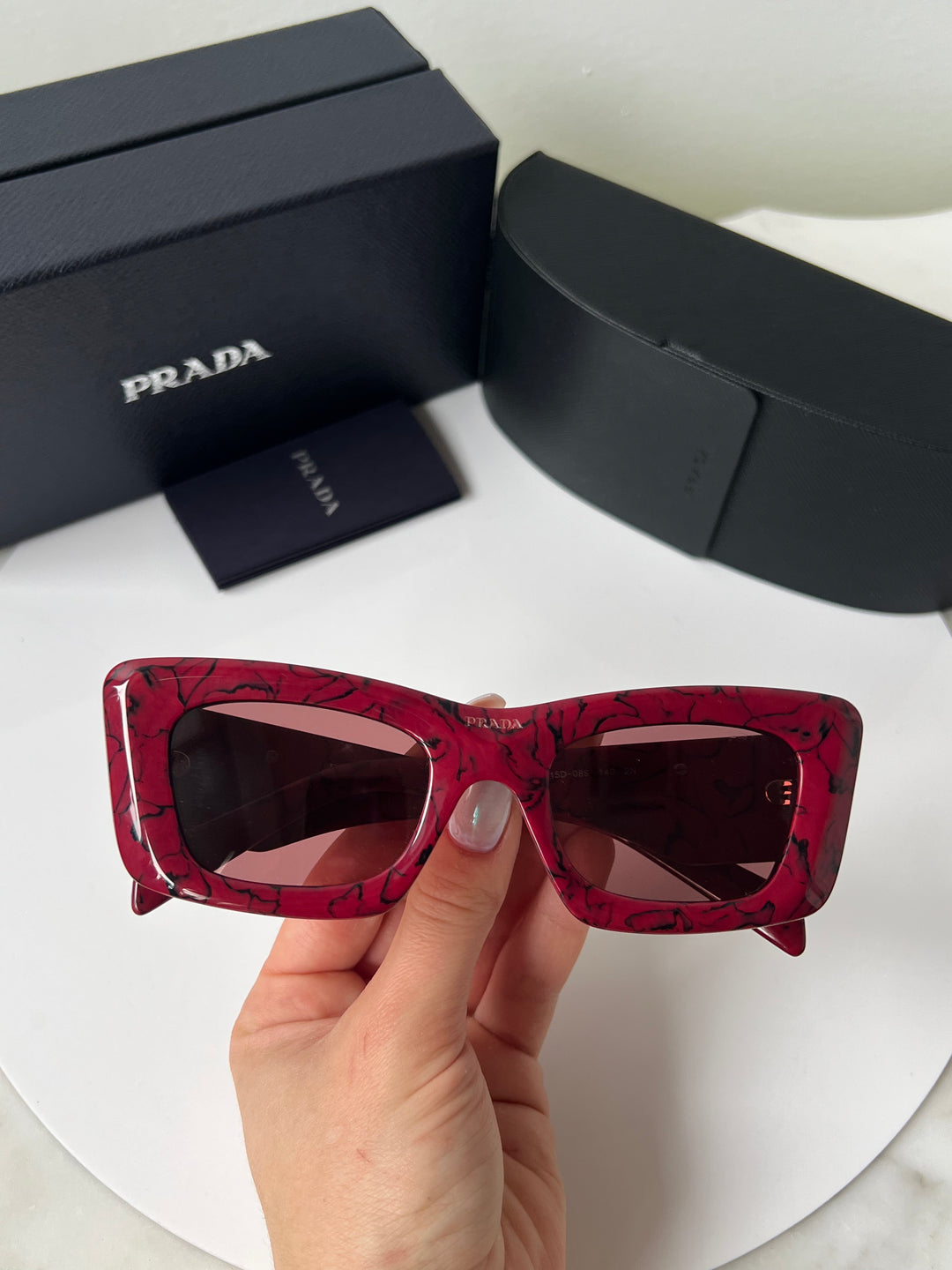 Prada sunglasses red frame best sale