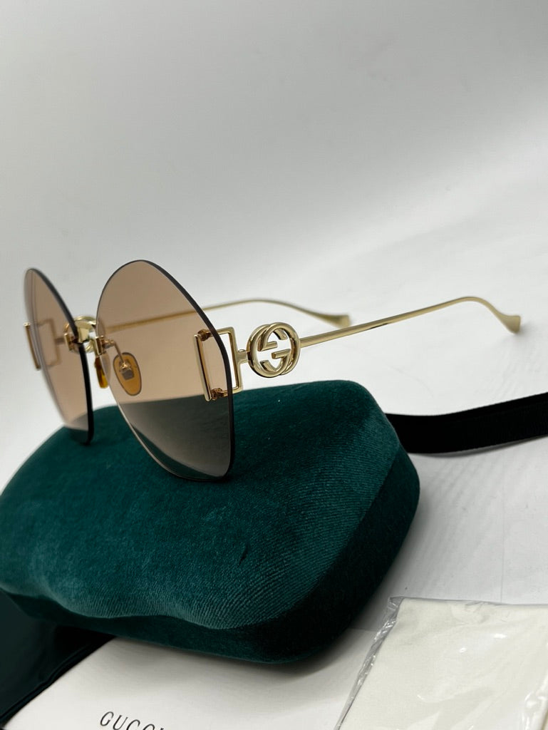 Gucci GG1203S Brown Gold Rimless Sunglasses