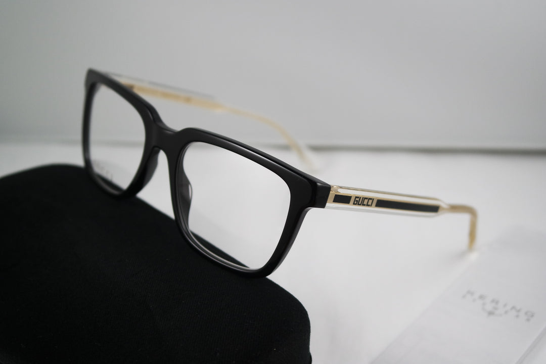 Monturas de anteojos rectangulares atrevidas Gucci GG0560O en negro
