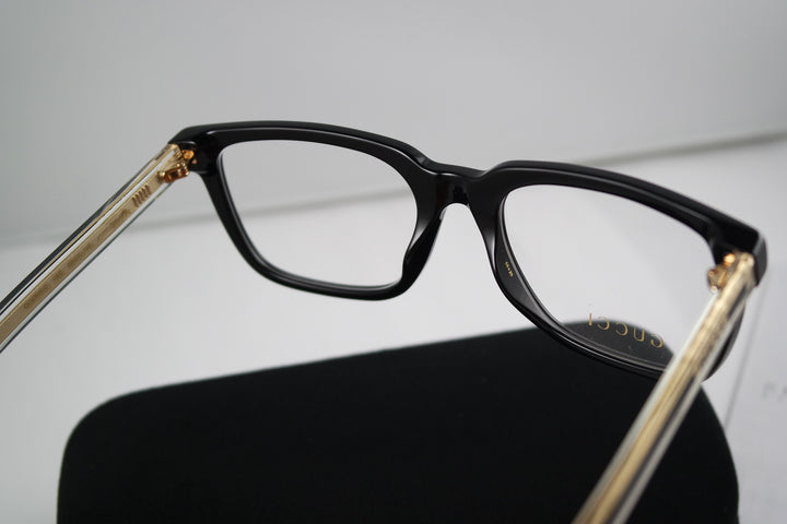 Monturas de anteojos rectangulares atrevidas Gucci GG0560O en negro