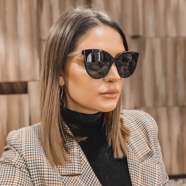 Gucci GG0565SN Gafas de sol negras con forma de ojo de gato y patas transparentes 
