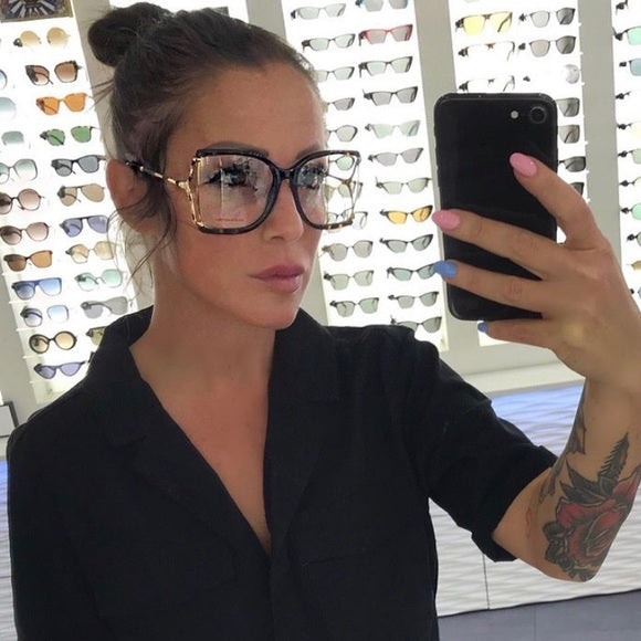 Monturas de anteojos con corte cuadrado extragrande en oro negro Gucci GG0592O